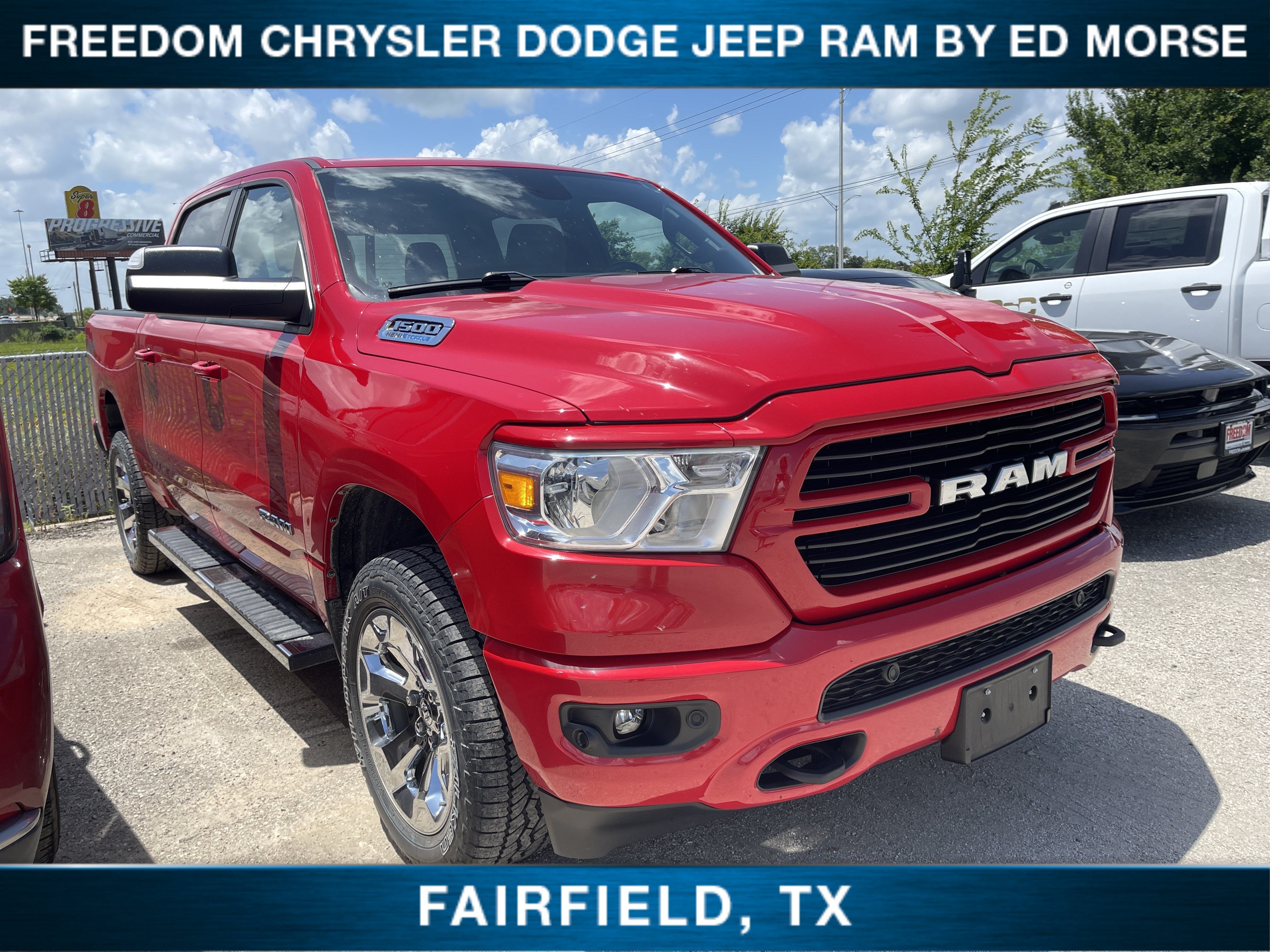 2021 RAM 1500 Lone Star in Flame Red Clearcoat — front three-quarter view
