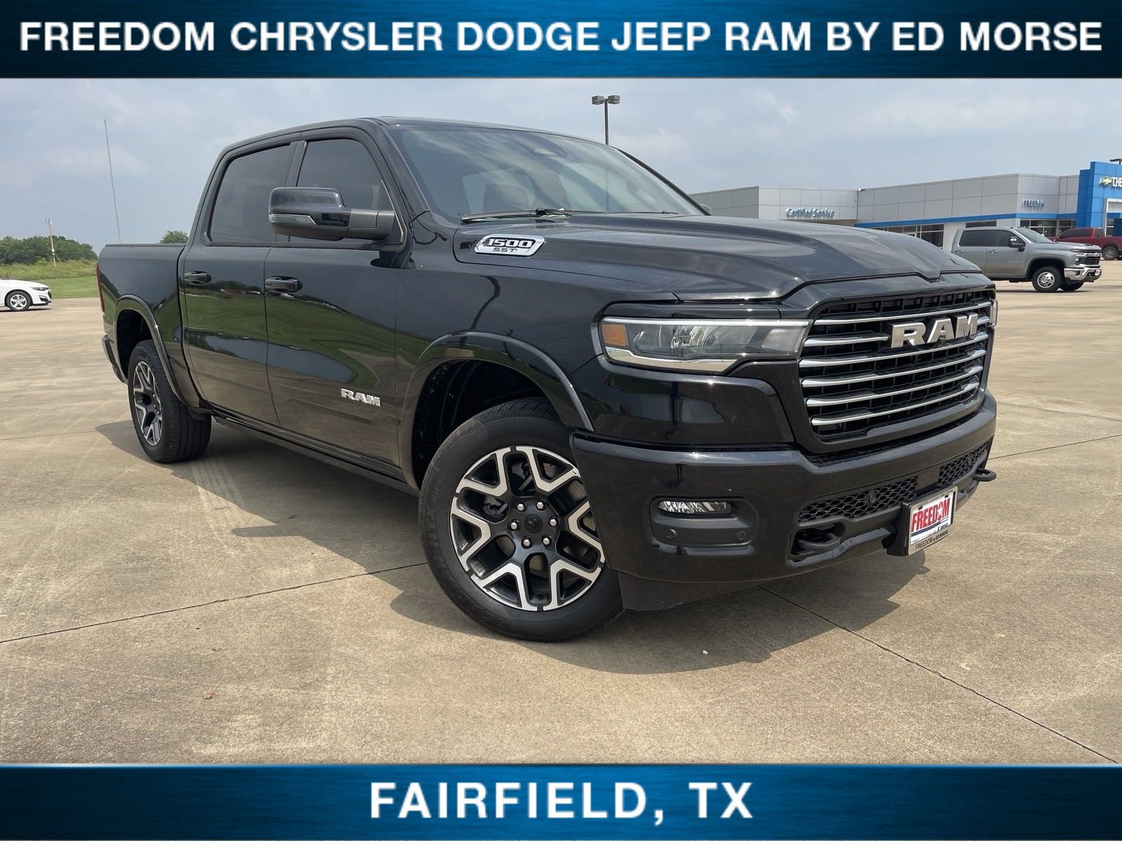 2025 RAM 1500 Laramie in Diamond Black Crystal Pearlcoat — front three-quarter view