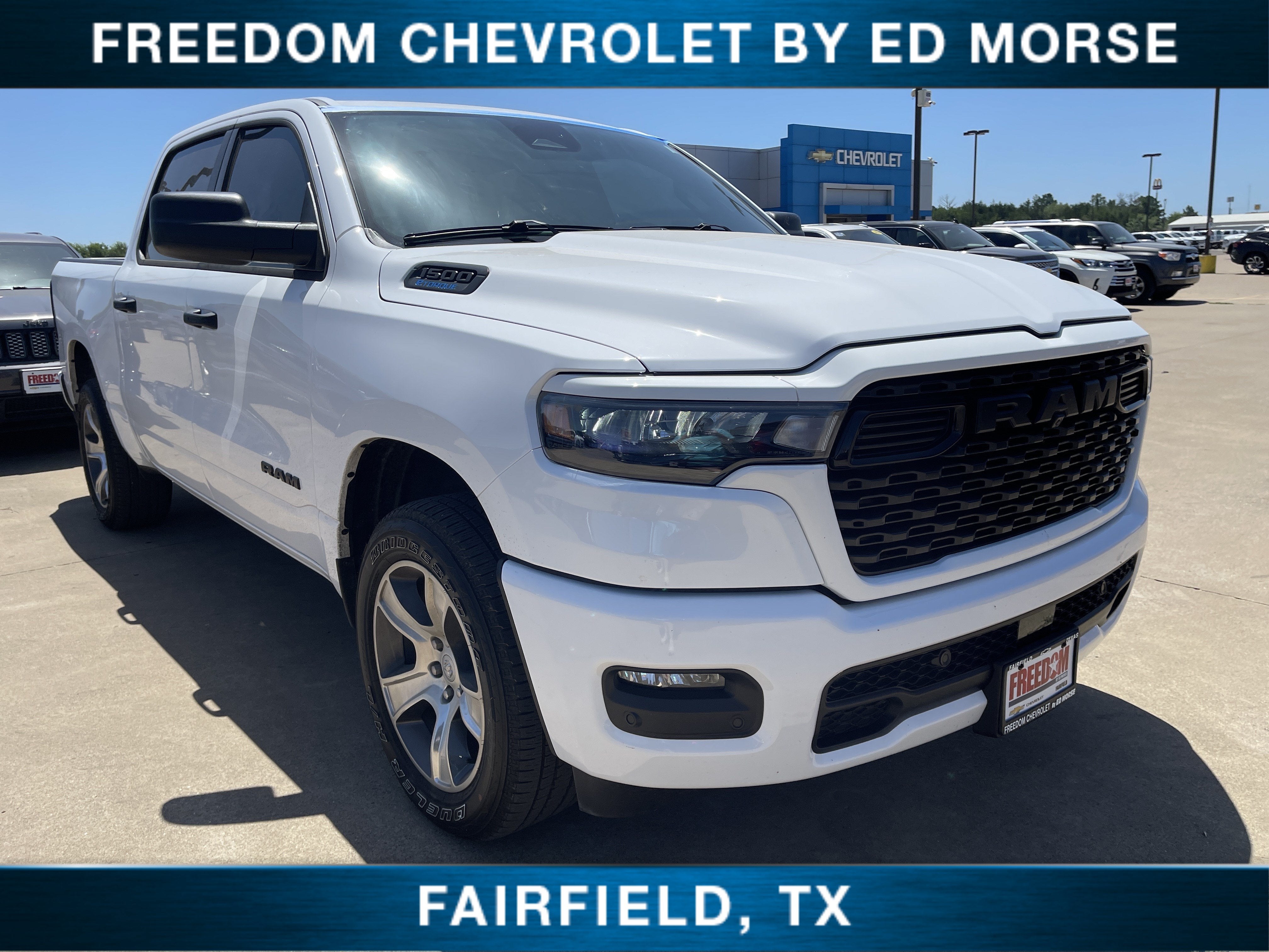 2025 RAM 1500 Tradesman in Whi/White — front three-quarter view