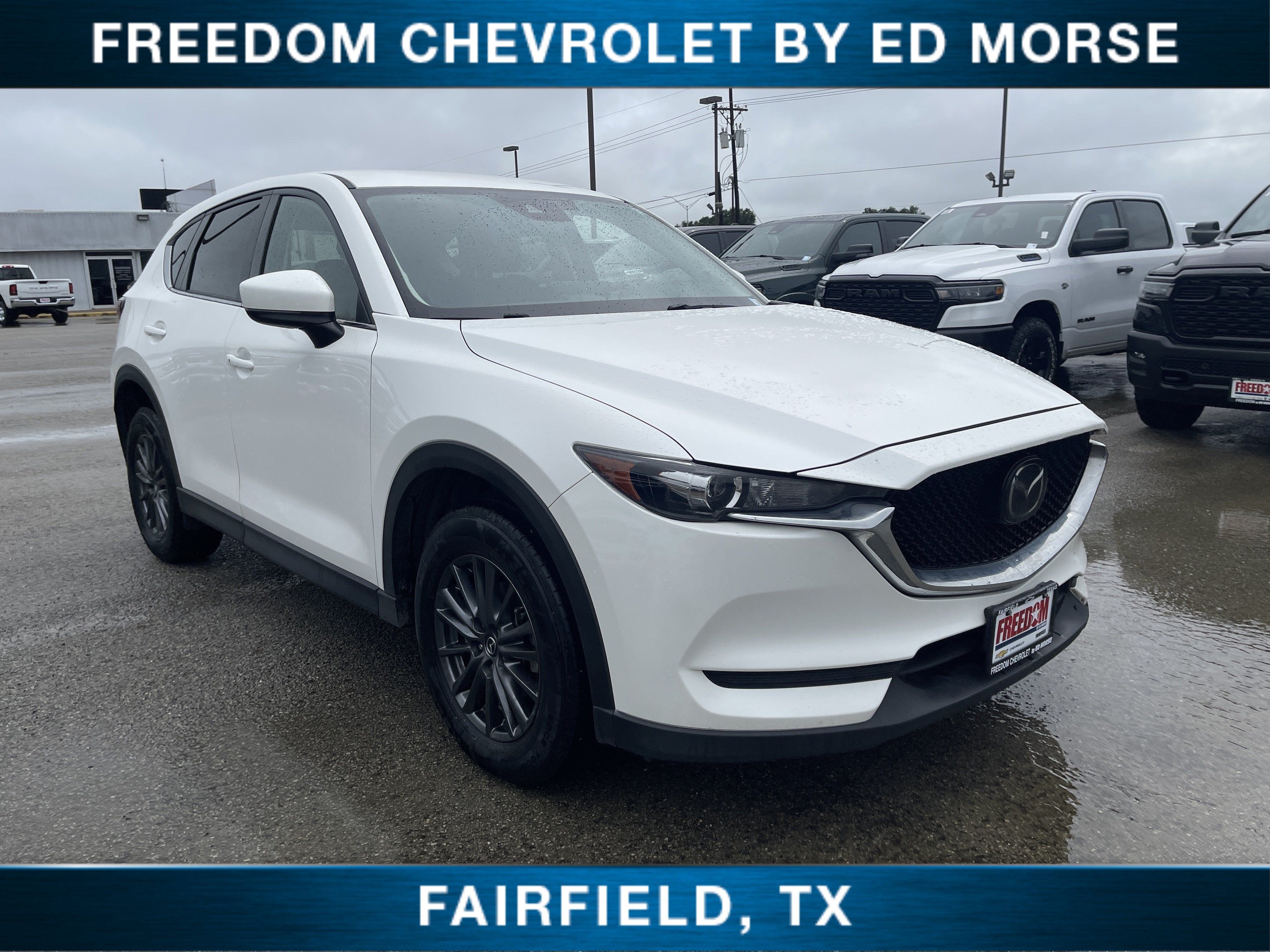 2021 Mazda Mazda CX-5 Touring in White — front three-quarter view